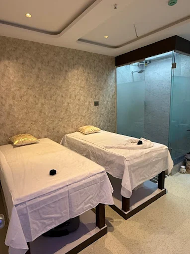 Two massage tables side by side in the couple massage room at Aurum Spa, Kharadi