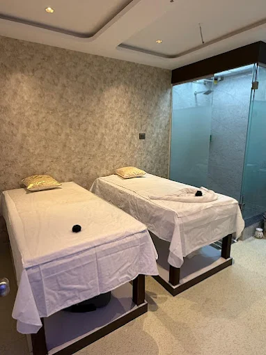 Two massage beds side by side in a treatment room at Aurum Spa, Kharadi